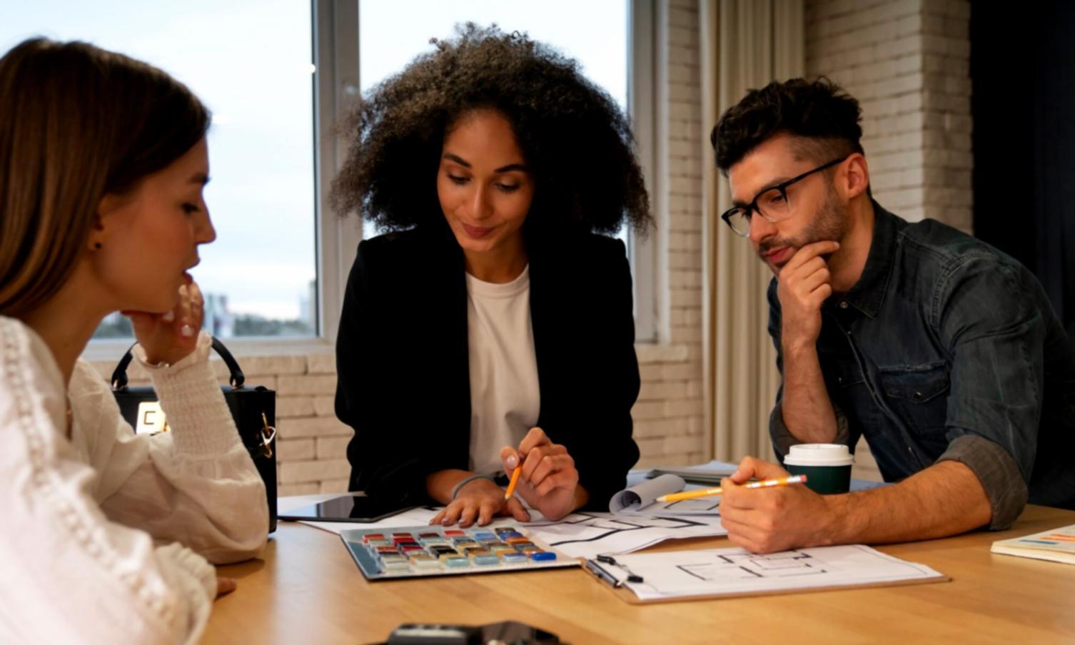 Professional reviewing financial documents and analysis materials on desk