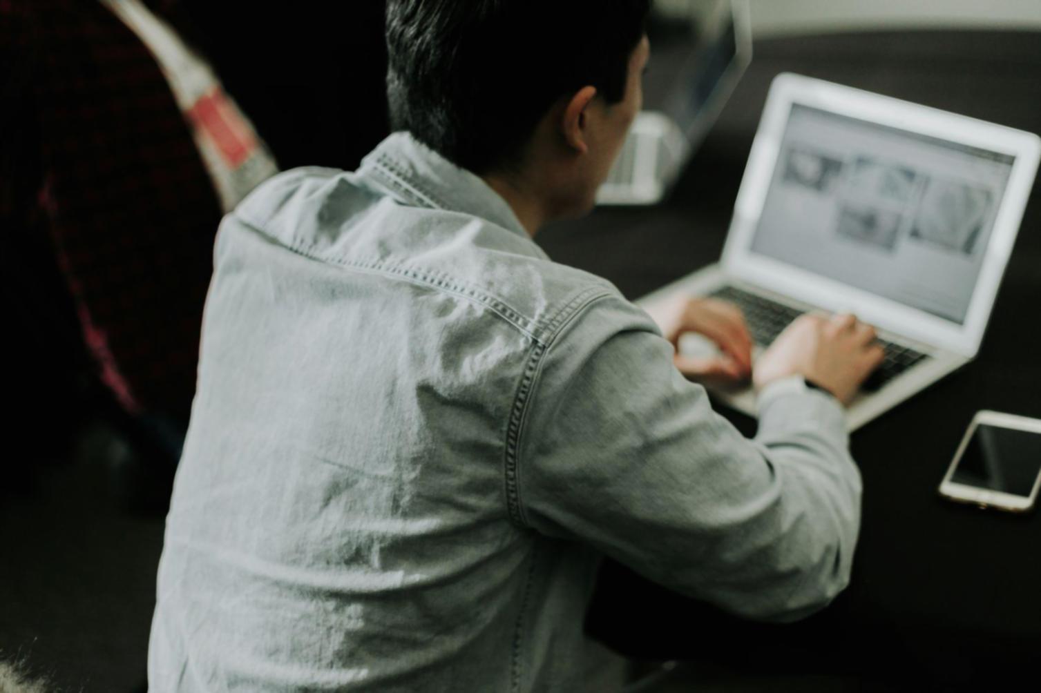 Team member reviewing financial process documentation with business owner